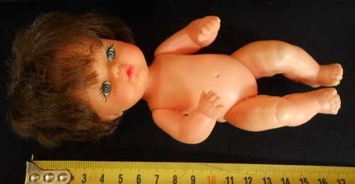 Vintage Hard Plastic and vinyl doll in original dress