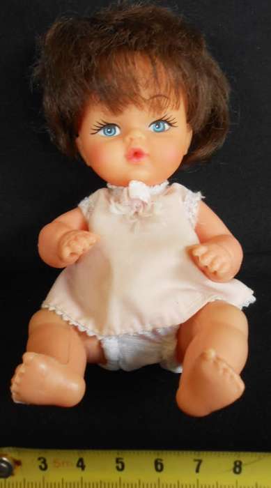 Vintage Hard Plastic and vinyl doll in original dress