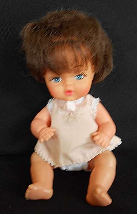 Vintage Hard Plastic and vinyl doll in original dress