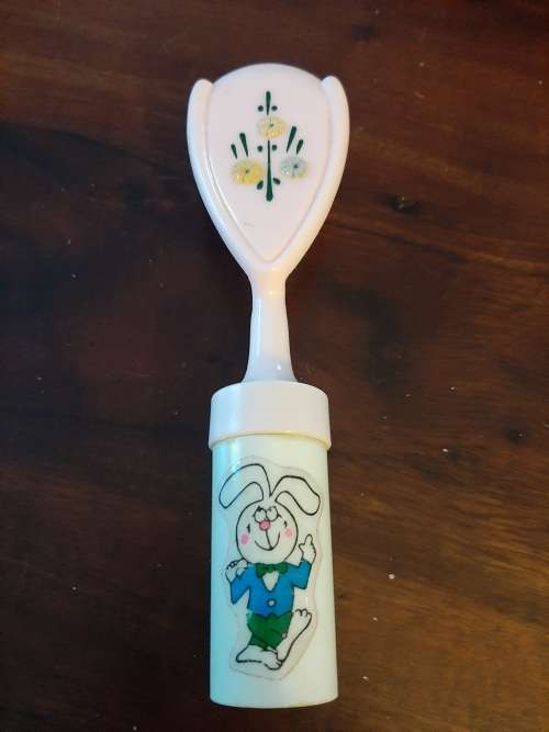Vintage baby brush with rattle