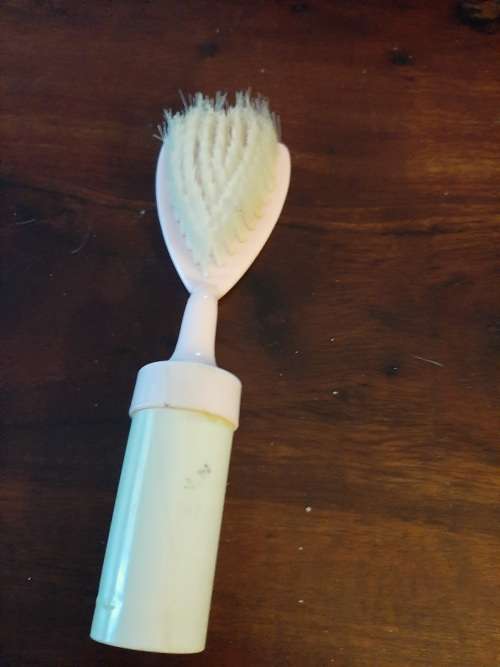 Vintage baby brush with rattle