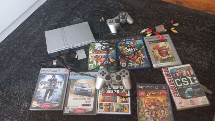 PS2 console with 8 games and 8mb card