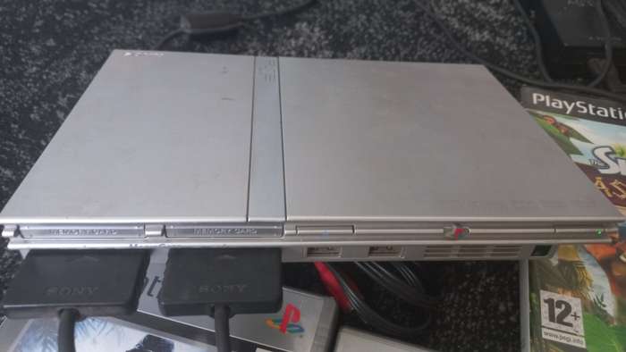 PS2 console with 8 games and 8mb card