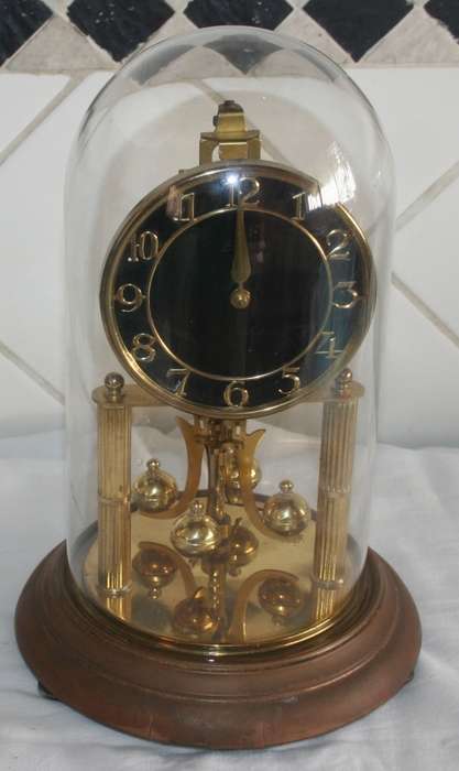 A STUNNING VINTAGE WEST GERMAN MADE KUNDO WIND UP DOME CLOCK WITH A BLACK FACE