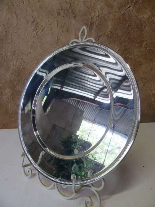 This timeless silver metal under plates will find itself on some of the best tables around.