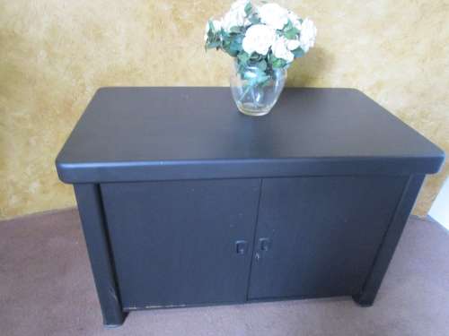 A TRENDY CHABBY CHIC HEAVY ENTERTAINMENT UNIT OR SIDE BOARD FINISHED IN A BLACK SPARROW CHALK PAINT