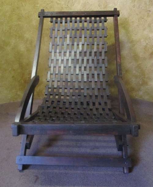 WOW A A LOVLEY LARGE WOODEN LOUNGER CHAIR WITH WEAVED BLOCKS FOR THE SEAT