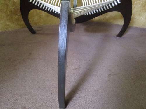 A EXQUISITE DESIGNER CHAIR WITH A DARK WOOD AND ROPE DESIGN ABSOLUTELY STUNNING