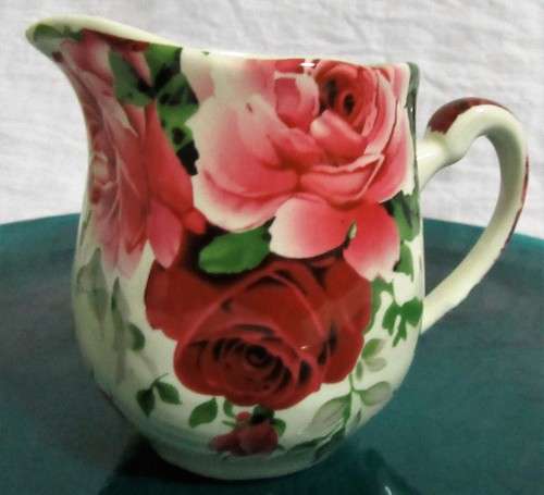 A STUNNING FLORAL VICTORIAN ROSE MILK CREAMER BY WILLIAM JAMES -