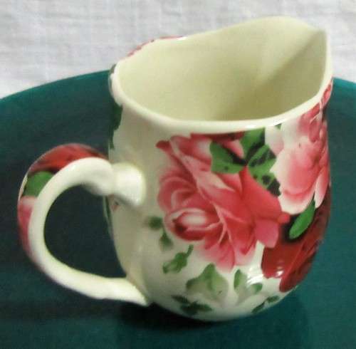 A STUNNING FLORAL VICTORIAN ROSE MILK CREAMER BY WILLIAM JAMES -