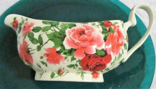 A STUNNING FLORAL VICTORIAN ROSE SAUCE BOAT BY WILLIAM JAMES -
