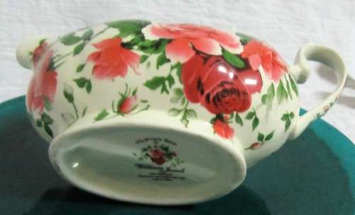 A STUNNING FLORAL VICTORIAN ROSE SAUCE BOAT BY WILLIAM JAMES -