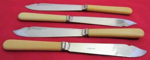 This is a vintage set of 4  English bone handled and silver plated knifes. Hallmarked EPNSA