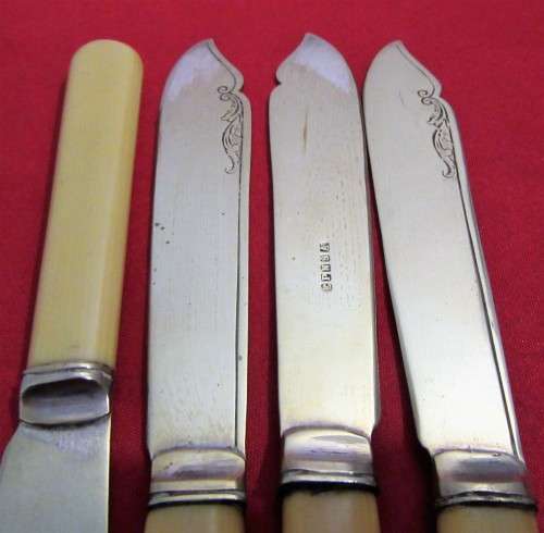 This is a vintage set of 4  English bone handled and silver plated knifes. Hallmarked EPNSA