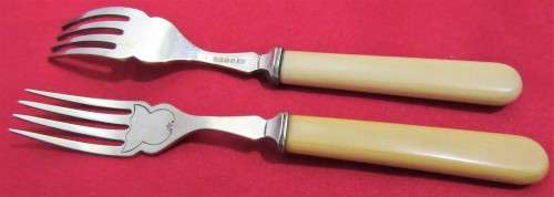 This is a vintage set of 6  English bone handled and silver plated forks. Hallmarked EPNSA
