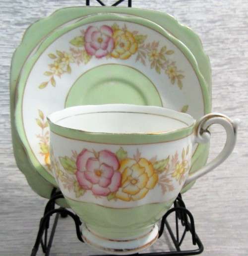 This lovely mid-century tea cup Trio set  were made in England by Bell China.