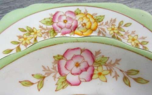 This lovely mid-century tea cup Trio set  were made in England by Bell China.