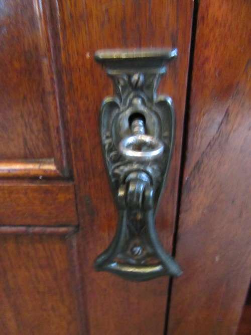 WOW BEEN TOLD THIS IS A ANTIQUE DRS CUPBOARD IT IS REAL SHOW STOPPER FINISHED IN BURMESE TEAK