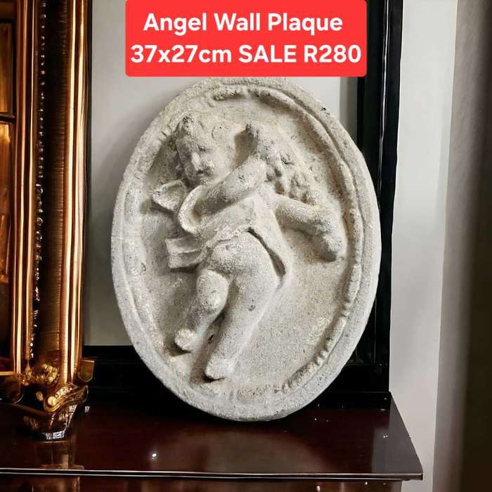 Cement Angel wall Plaque measuring 37x27cm.