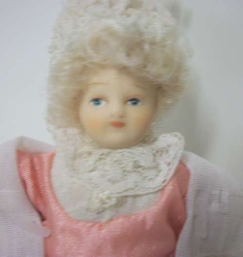 9 Miniature Dolls