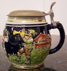 German Stein in raised design with hinged lid - Nice!