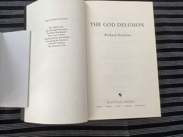 The GOD Delusion, by Richard Dawkins, Large format Paperback in a Fine Condition.