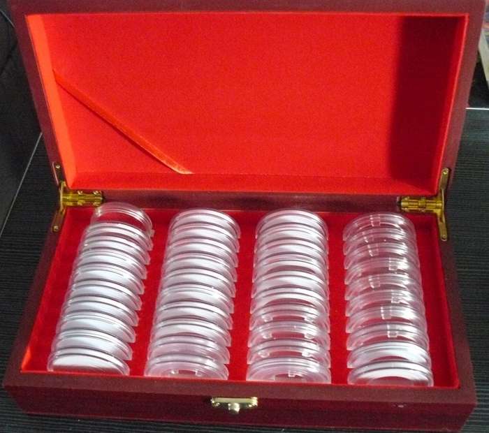 WOODEN BOX FOR 40 CAPTULES. SOME CAPTULES IN USED CONDITION OD 50MM IN NO COIN INCLUDED