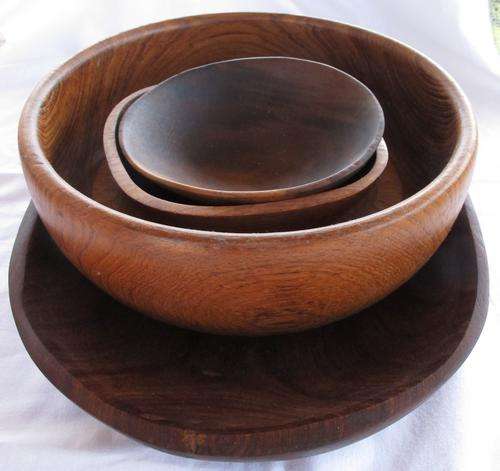 FOUR WOODEN BOWLS AND ONE WOODEN SIDEPLATE