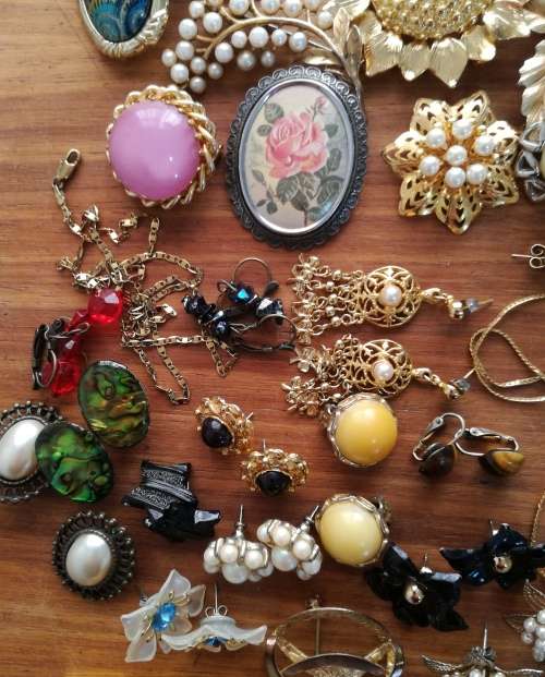 Large collection of vintage and costume jewelry. Some silver earrings.