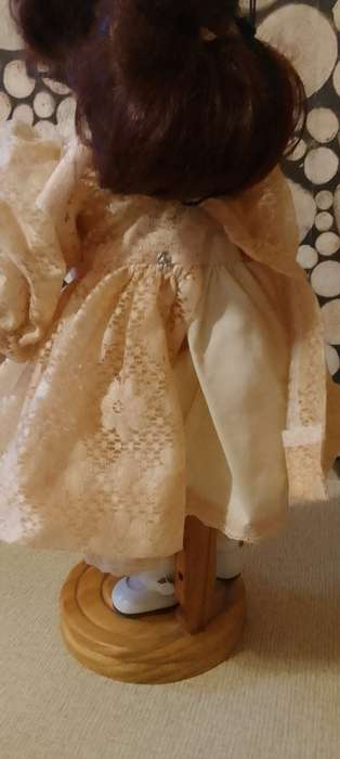 PORCELAIN DOLL - vintage- 40 cm long - ON WOODEN BASE