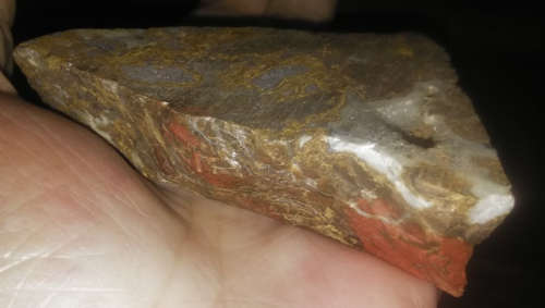 Mugglestone,  ( Tiger Iron), is a unique combination of Tigers Eye, Red Jasper, and Hematite