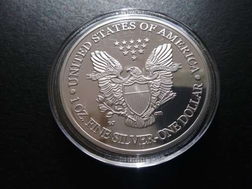 1 OZ. FINE SILVER. ONE DOLLAR. STATUE OF LIBERTY. THE EAGLE. SILVER CLAD. ENCAPSULATED.