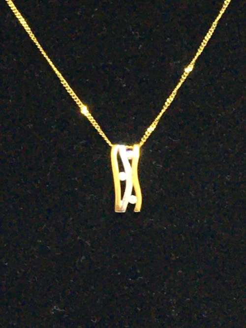 3.1 grams 9 carat Yellow Gold Chain with a Two Tone and Diamond Pendant