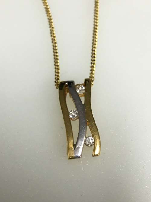 3.1 grams 9 carat Yellow Gold Chain with a Two Tone and Diamond Pendant