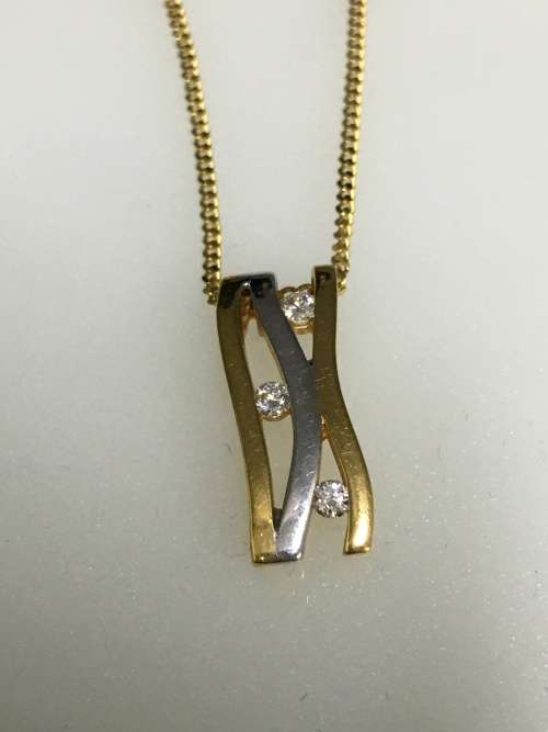 3.1 grams 9 carat Yellow Gold Chain with a Two Tone and Diamond Pendant