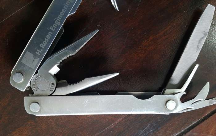 Leatherman LM832518 Heritage PST Multi-tool number 0298 with leather and synthetic pouch, like new
