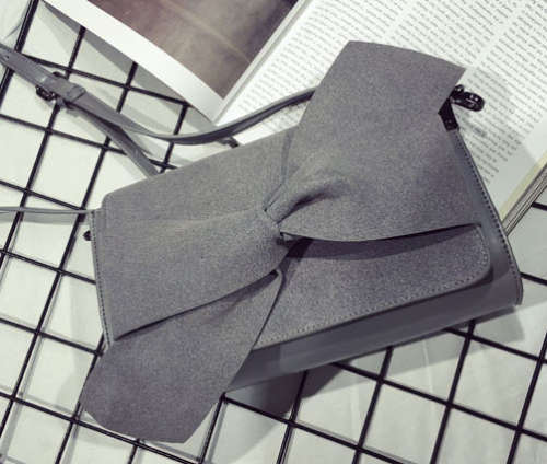 Nubuck bowknot clutch. Grey color. Stock in ZA.