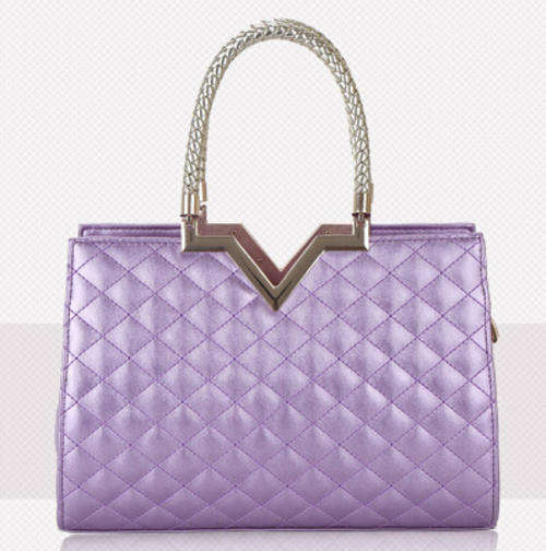 Classic magazines size ladies handbag. Purple color.