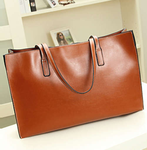 Simply design wild match large handbag. Brown color. Stock in ZA