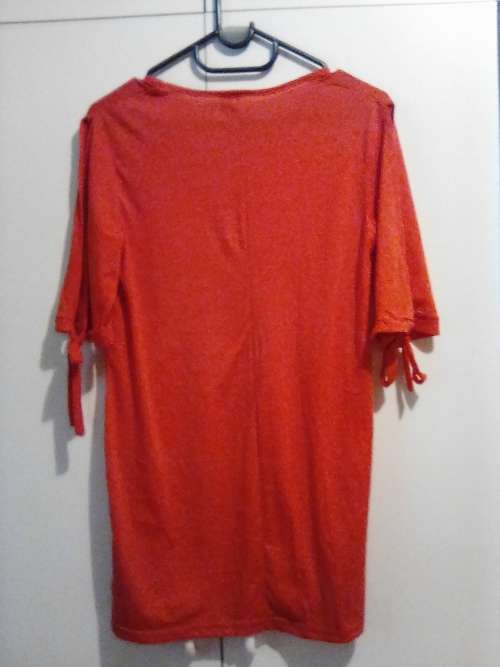Red top with ties to pull up sleeves 32