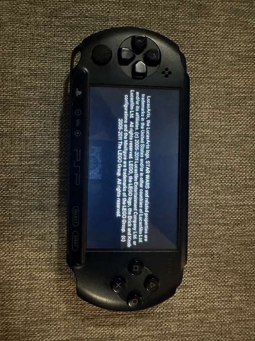 Sony psp street E1008 with 4gb memory card and 5 games.