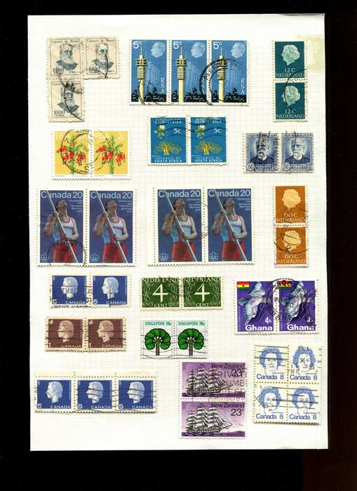 World Mix in Multiples - 39 Stamps  Mounted On Old Album Page