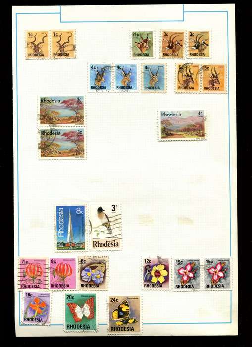 Rhodesia - 24 Stamps on Old Album Page