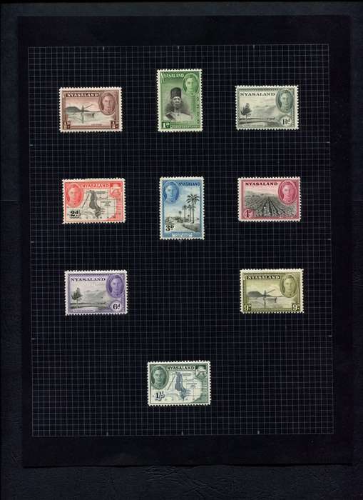 Nyasaland - 9 Stamps Mounted (Hinged) on Old Album Page