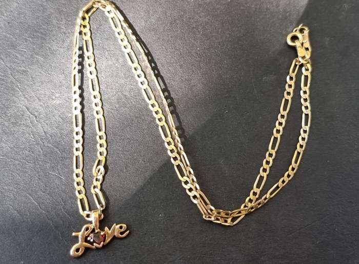 9CT `FIGARO CHAIN` / Heart shape `GARNET` Set in a `LOVE` Pendant ( Genuine Gold )