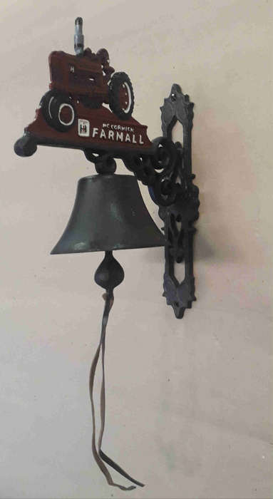 Farmall cast iron wall mounted bell.