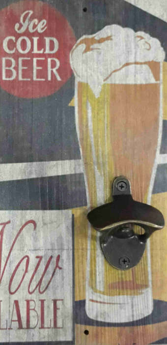 Ice cold beer advert board with bottle cap opener.