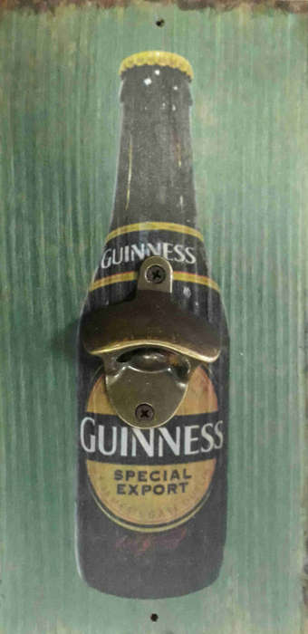 Guinness special export advert board with bottle cap opener.