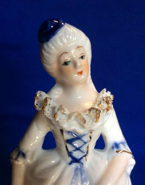 Matching Pair of Blue and White Porcelain Figurines