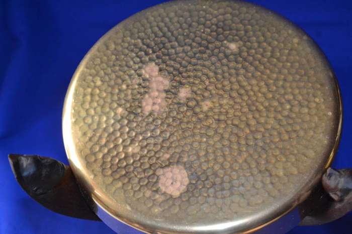 Small carved Tripod Table with Hammered Brass Top
